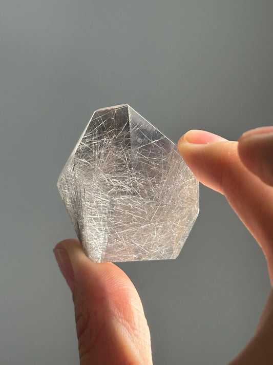 Quartz with Rutile on Stand